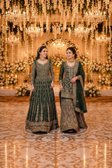 Deep green bridal ensemble with gold work · Standing front detail view