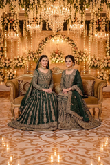 Deep green bridal ensemble with gold work · Seated front view